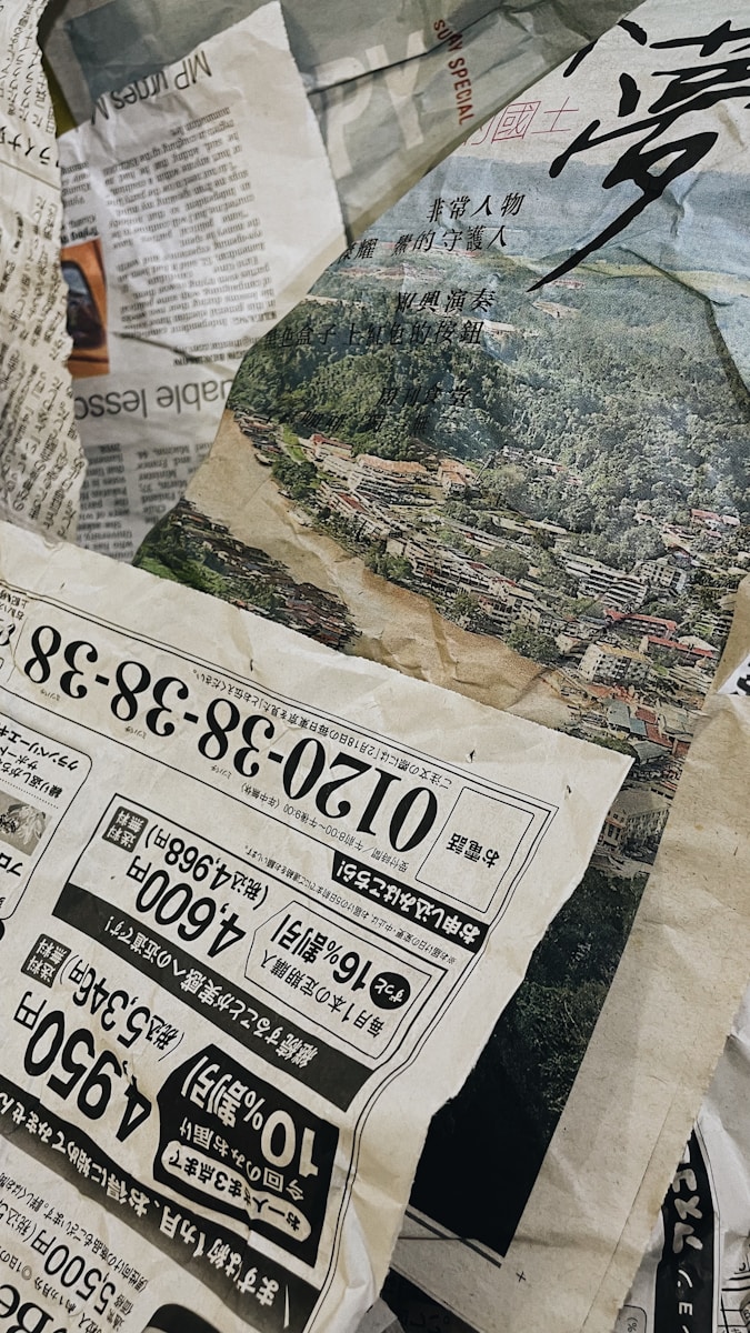 a pile of newspapers with asian writing on them