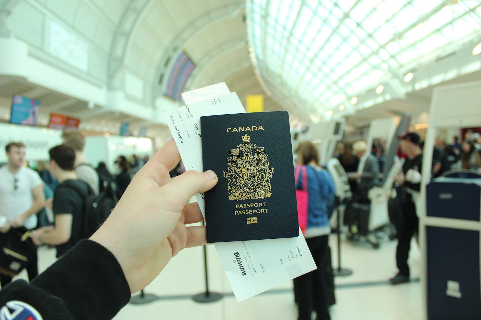 person holding Canada passport
