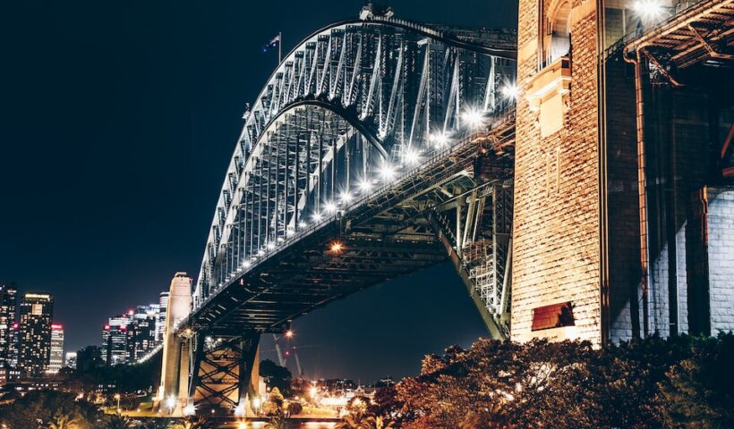 black and brown concrete bridge during night time