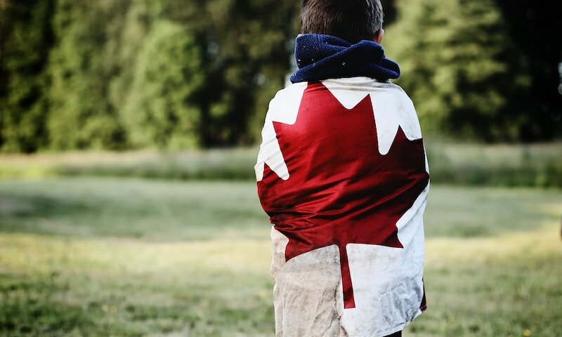 child wearing Canada flag